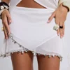 Calyptra mini-rok van chiffon met kralenrand