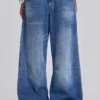 Colossus Jeans met studs in middenblauwe wassing