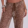 Deva broek van gebreide stof met pailletten in zandkleur