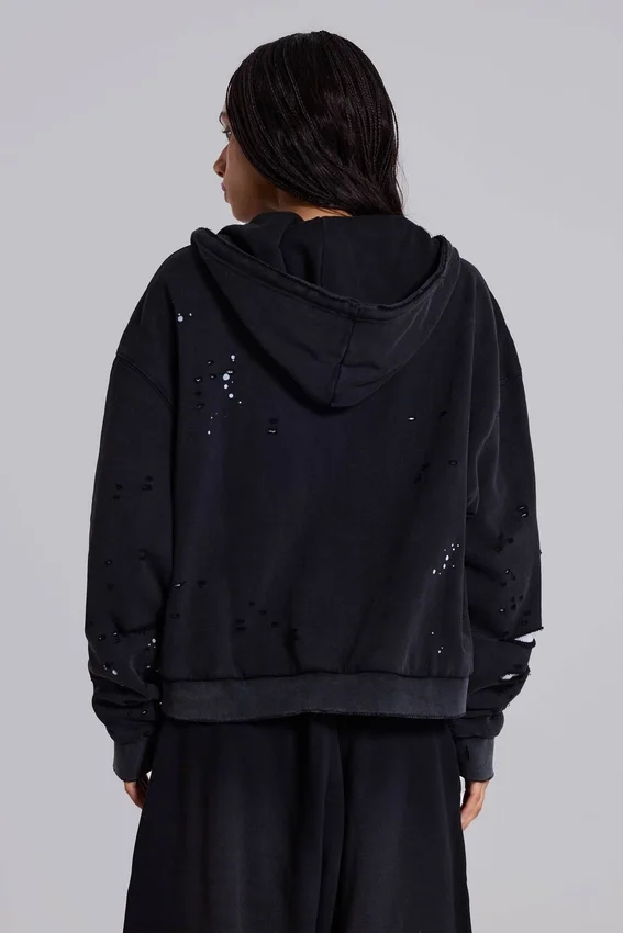Gewassen zwarte, door de zon verbleekte hoodie met rits en wafelvoering