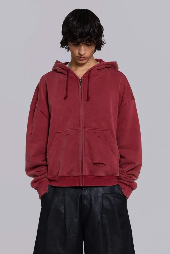 Rode, door de zon verbleekte hoodie met rits en wafelvoering