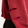 Rode, door de zon verbleekte hoodie met rits en wafelvoering