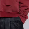 Rode, door de zon verbleekte hoodie met rits en wafelvoering