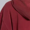 Rode, door de zon verbleekte hoodie met rits en wafelvoering