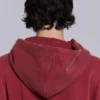 Rode, door de zon verbleekte hoodie met rits en wafelvoering