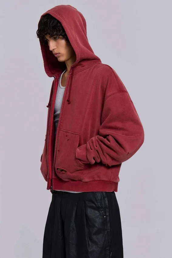 Rode, door de zon verbleekte hoodie met rits en wafelvoering