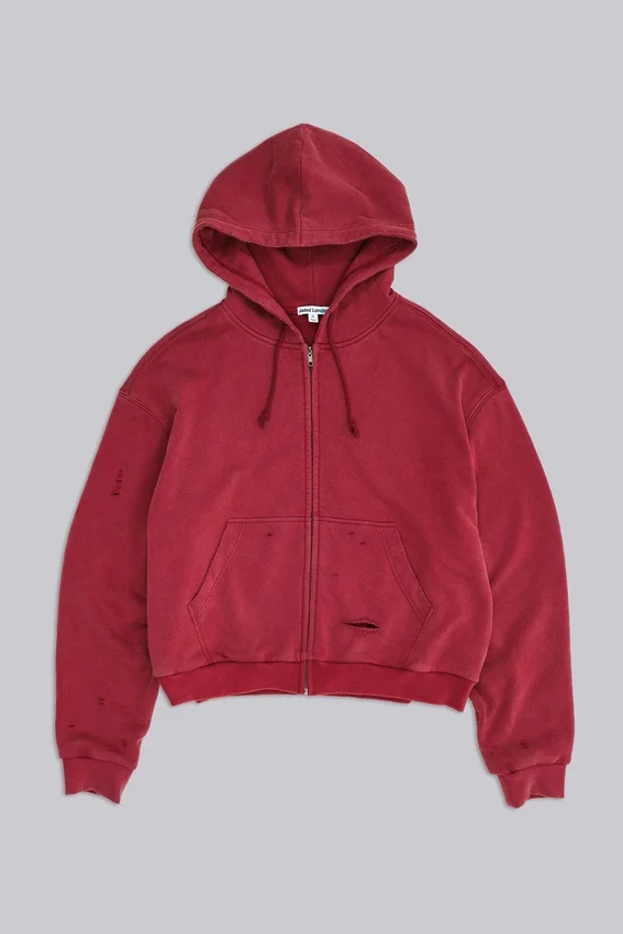 Rode, door de zon verbleekte hoodie met rits en wafelvoering