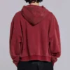Rode, door de zon verbleekte hoodie met rits en wafelvoering