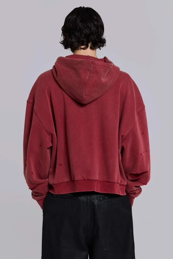 Rode, door de zon verbleekte hoodie met rits en wafelvoering