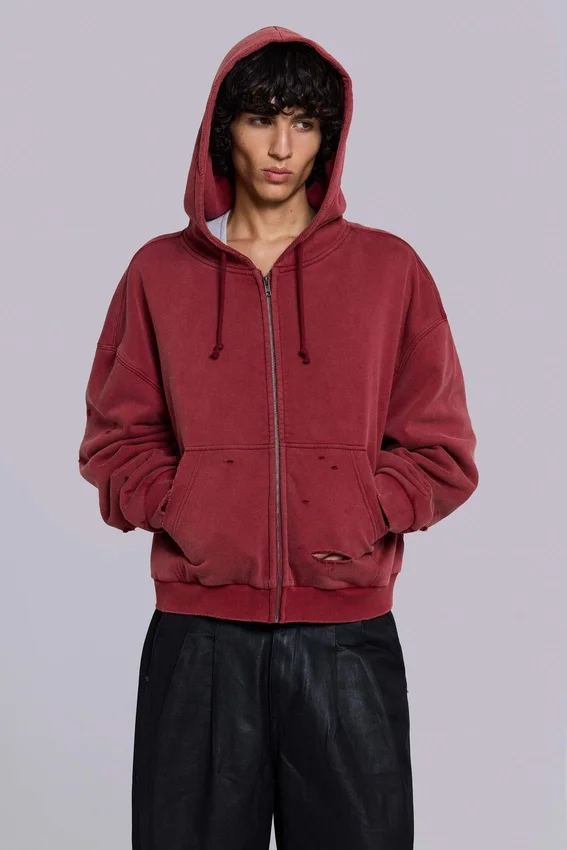 Rode, door de zon verbleekte hoodie met rits en wafelvoering