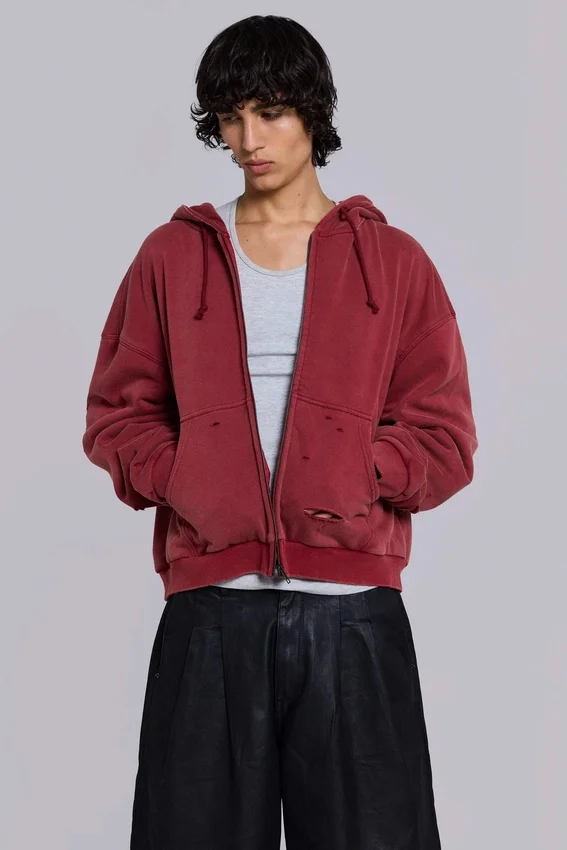 Rode, door de zon verbleekte hoodie met rits en wafelvoering