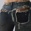 Tori versleten kanten bootcut-Jeans met lage taille