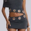 Zarco asymmetrische mini-jurk met oogjes